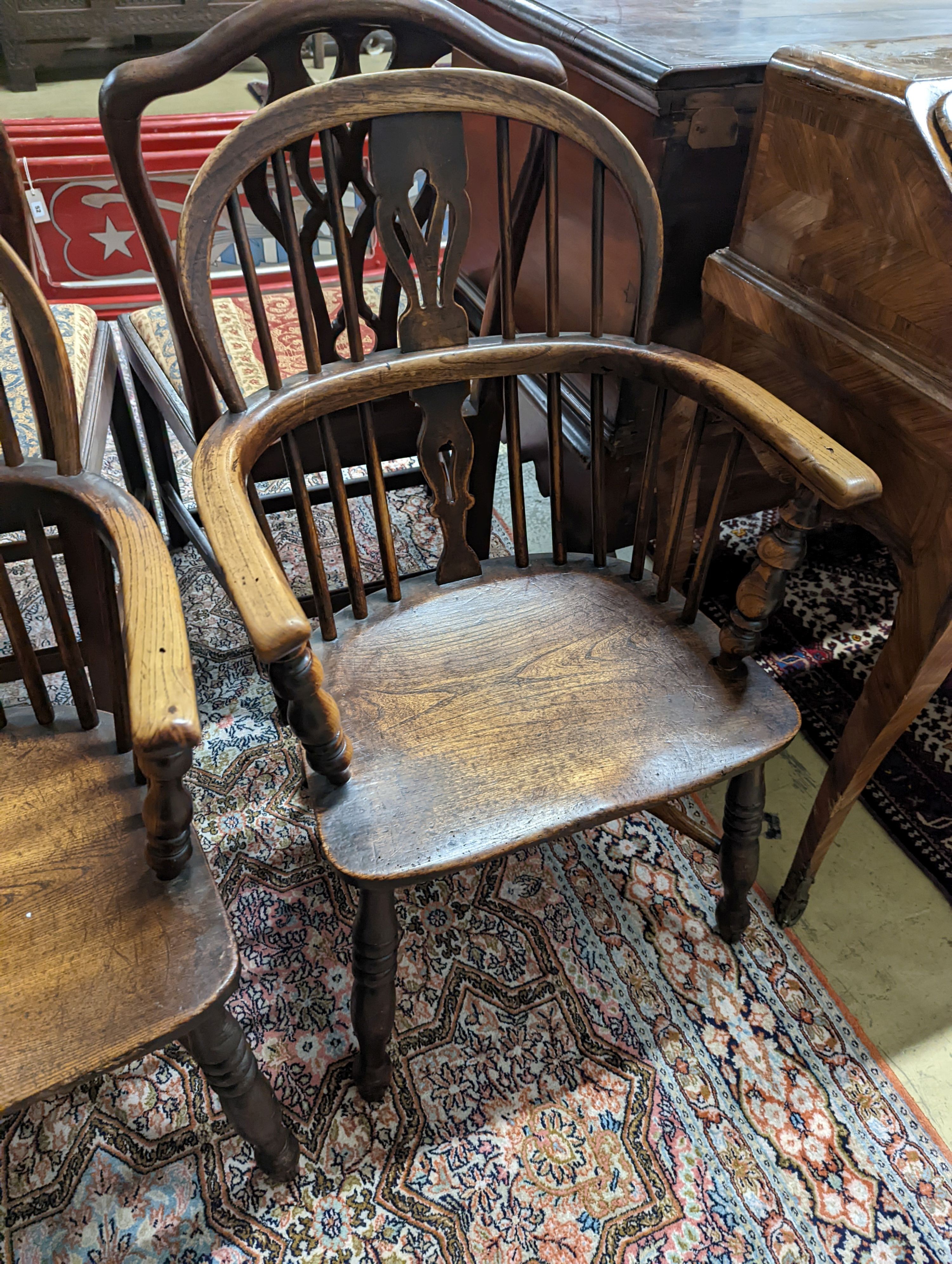 A pair of early 19th century ash and elm Windsor chairs. H-87cm.